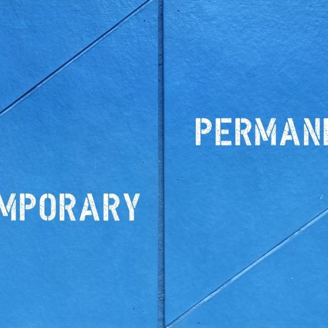 Blue wall with differnt direction sign point to PERMANENT (no end date which employee receives benefits package) or TEMPORARY (duration of employment with contract end date) employment